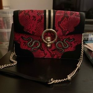 cute red and black bag with snakes on each side